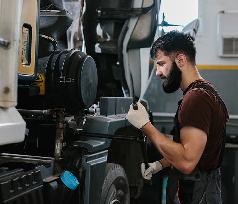 Mechanic working on a truck engine