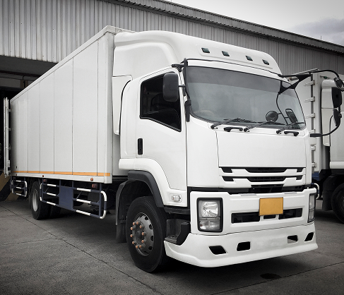 Large cargo truck near building