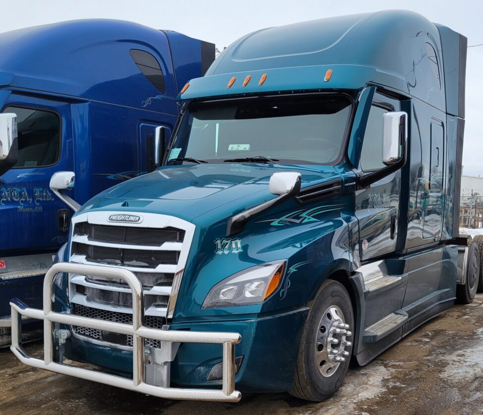 Teal semi truck with chrome bull bar