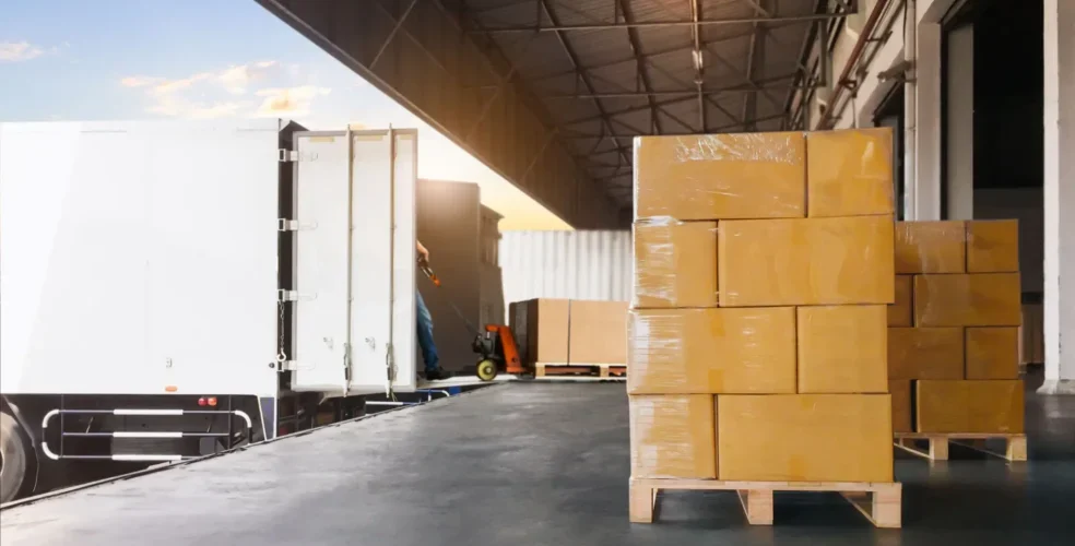 Warehouse loading dock with stacked cardboard boxes